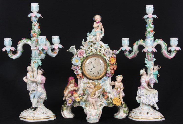 3 Pc. Meissen Porcelain Clock Set: 3 Pc. Meissen Porcelain Clock Set, Retailer, Black, Starr & Frost. Pr. 2 piece candlesticks with seated woman and young boy on one, seated man and young girl on the other, 3 serpentine candle arms wit
