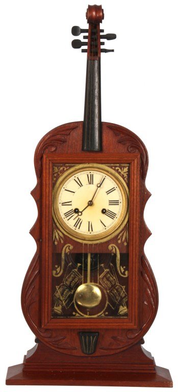 Reproduction of Seth Thomas Violin Clock: Reproduction of Seth Thomas Violin Clock. 5 in. paper dial with black hour numerals and open moon hands, 20th century reproduction spring driven movement is unsigned, has an half hour rack & snail str