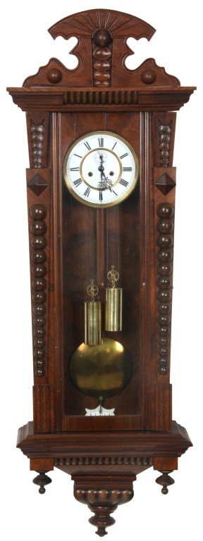 Walnut 2 Weight Vienna Regulator: Walnut 2 Weight Vienna Regulator. 7 in. inset porcelain dial has black Roman hour numerals, fancy pierced black hands, sub seconds dial and gilt brass bezel; brass 2 weight driven movement with half h