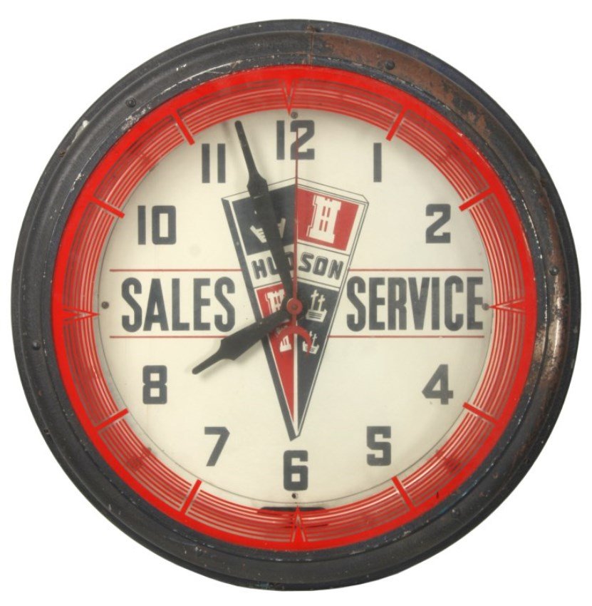 Hudson Sales & Service Neon Wall Clock: Hudson Sales & Service Neon Wall Clock. 14 in. painted metal dial with black hour numbers, “Hudson Sales & Service” advertising in the center, sweep seconds hand, large hour & minute hands; revers