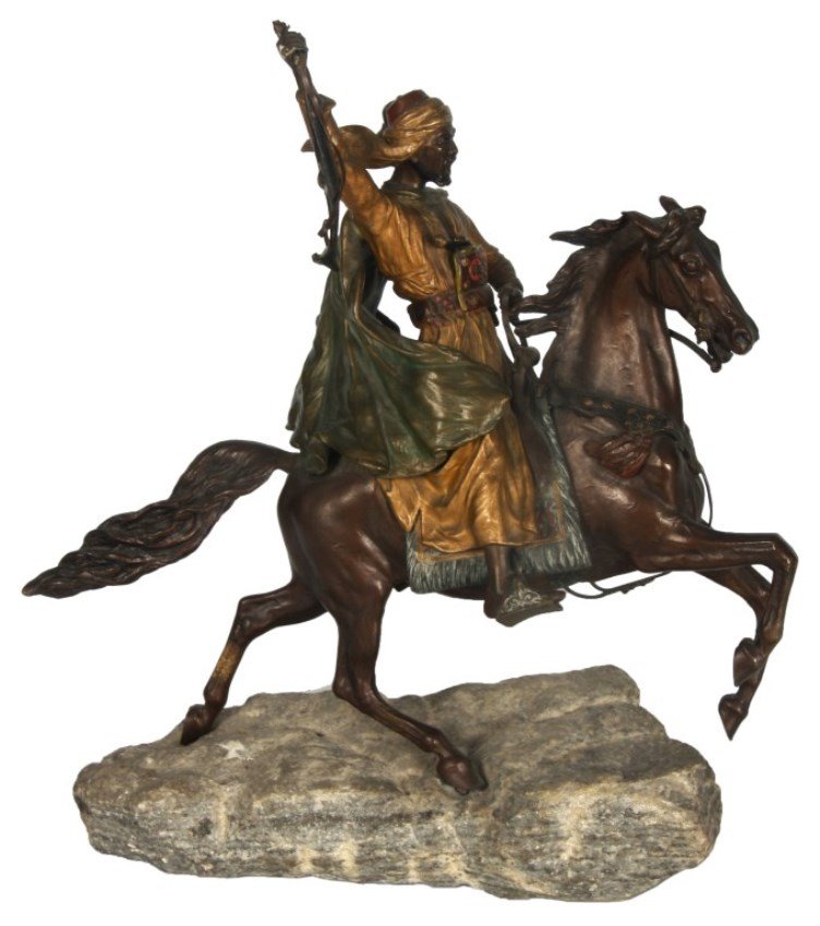 Franz Bergman Bronze Arab Warrior: Franz Bergman Austrian Cold Painted Figural Bronze Arab Warrior on Horseback. An expressive scene with an Arab warrior on the back of a galloping horse, he wears golden robes with pistol and dagger in