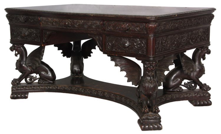 RJ Horner Winged Griffin Partners Desk: R.J. Horner Figural Carved Winged Griffin Mahogany Partners Desk. Top has a carved border with rounded corners, a wide center drawer with a serpentine front, 2 drawers on the right side and faux drawe