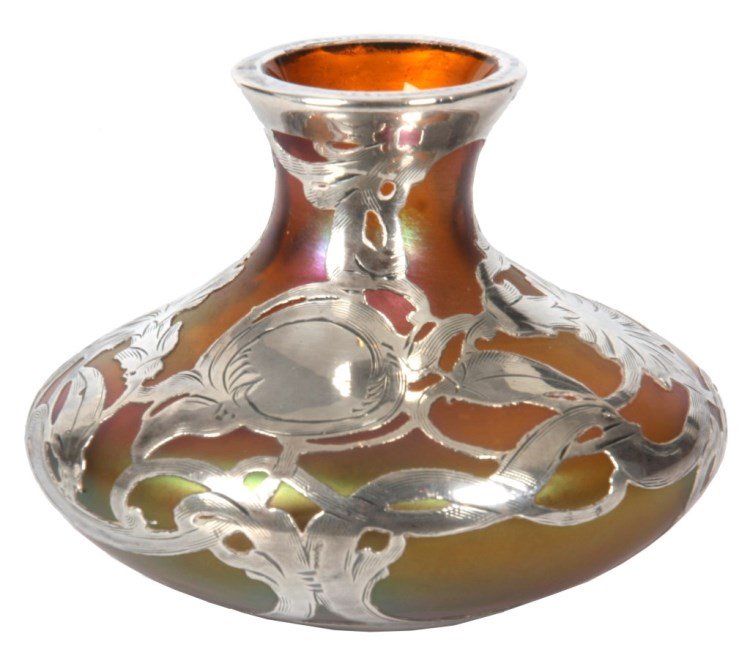 Iridescent Gold & Sterling Overlay Vase: Iridescent Gold & Sterling Overlay Vase. Gold iridescent glass vase attr: Loetz, has a wide body with narrow bottle neck and flared rim; gold iridescent surface is highlighted in tones of red and gree