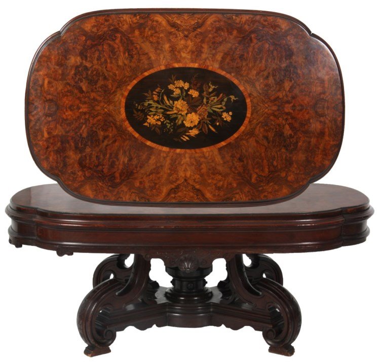 Walnut Inlaid Top Coffee Table: Walnut Inlaid Top Coffee Table. Burled walnut top with ebonized oval center panel having intricate floral cluster & filigree inlays; the apron has lower carvings with seashell mounts and incised highl