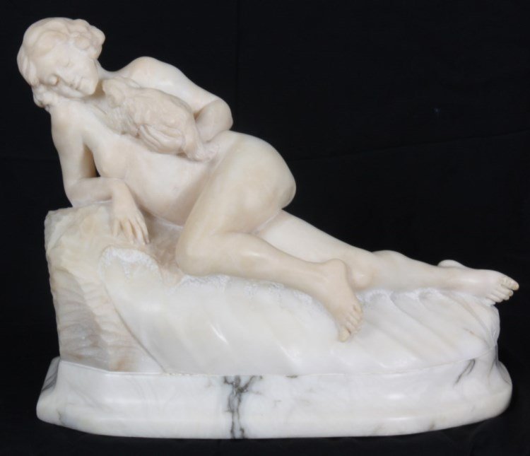 Carved Alabaster Sculpture of a Woman: Carved Alabaster Sculpture of a Woman. Nude figure of a young woman reclining on her right hip with her left knee raised forward, she's propped up on her right elbow, in her left arm she cradles a sma