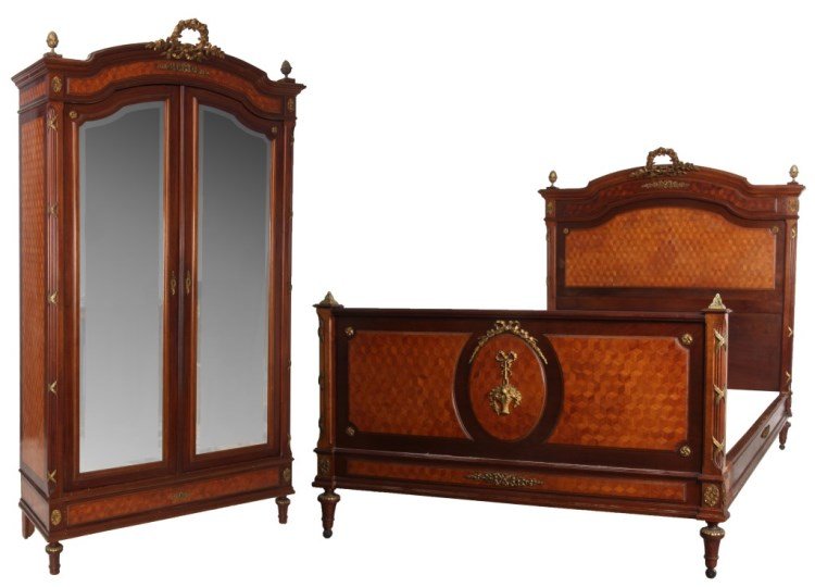 2 Pc. Inlaid French Bedroom Set: 2 Pc. Inlaid Mahogany French Bedroom Set. Headboard has an arched top with large gilt bronze wreath crest over a raised inlaid panel with filigree mount and pineapple finials, raised inlaid panel belo