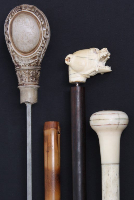 Lot of 3 Canes: Lot of 3 Canes. Bamboo walking stick with 21.5 in. sword in the shaft, resin knob handle with carved filigree and scrimshaw style oval panels commemorating Horatio Nelson of the British Navy with port