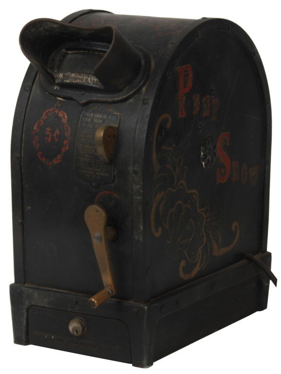 Mutoscope Peep Show Coin Op Machine: Mutoscope Peep Show Coin Op Machine. 5 Cent coin operated peep show machine displays a reel series of photos of a woman dancing, the early form of motion picture turns the reel flicking over the cards