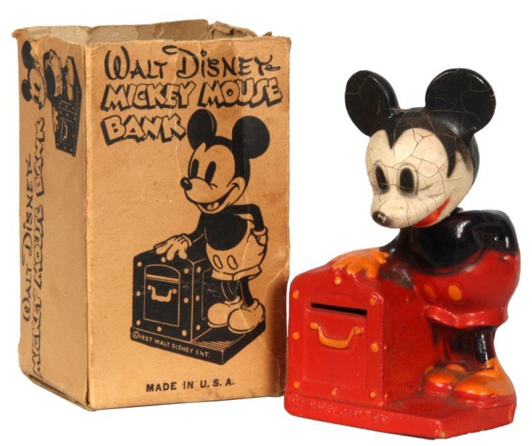 Mickey Mouse Crown Toy Bank: Mickey Mouse Crown Toy Bank. Composition bank with painted Mickey Mouse figure standing beside a treasure chest, figure has a bobbing head. In original box, missing box lid, missing key, head is loose