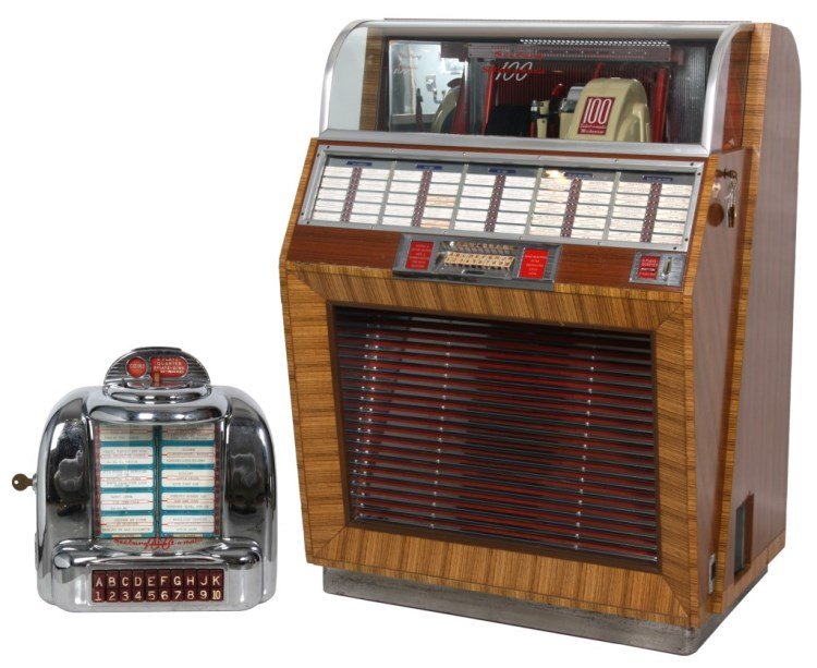 Seeburg Model 100A Jukebox W/ Wall Box – 1949: Seeburg Model 100A Jukebox W/ Wall Box – 1949. Beautiful wood veneered case with curved glass top displaying the Select-O-Matic 100 mechanism, plays both sides of the 78 RPM records; has selection l