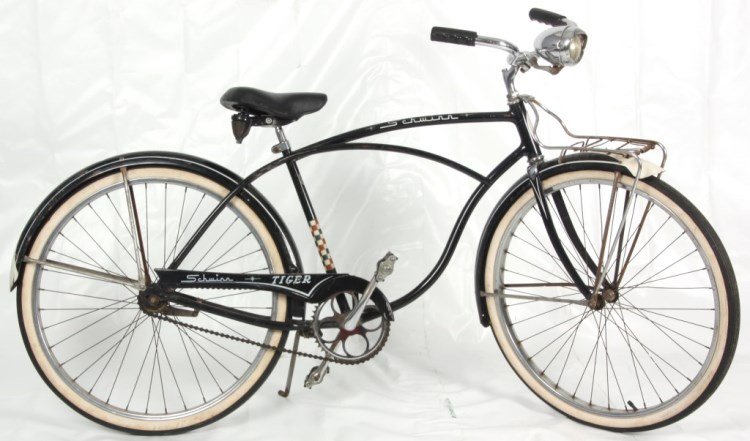 Schwinn Tiger Single Speed Cruiser: Schwinn Tiger Single Speed Cruiser. With front rack, front and rear fenders, spring cushion seat, Eagle “134” white walled tires; has scratches to the fender, guard and black frame paint. C.1955-1