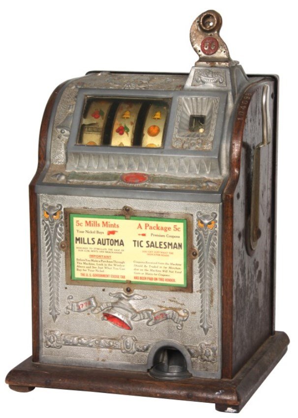 Mills O.K. 5 Cent Slot Machine: Mills O.K. 5 Cent Slot Machine. Oak case with cast aluminum front, decorated with owls and Liberty bell with 1776-1924 banner and goose neck coin slot; 3 reel type slot machine with silver Bell Fruit 