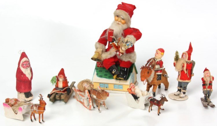 9 Figural Santa Clause Decorations: 9 Figural Santa Clause Decorations. Christmas decorations, tin litho battery operated mechanical toy bank with Santa Clause figure dancing and seated on top of a roof and has light up eyes, by Neol De
