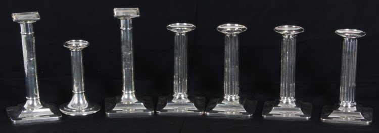 7 Tiffany & Co. Weighted Candlesticks: 7 Tiffany & Co. Weighted Candlesticks. 1) single candlestick has a stepped trumpeted base with ribbed collar at the base of the stem, monogrammed "JD" on the stem (5.25 in. high). 2) Pr. candlesticks 