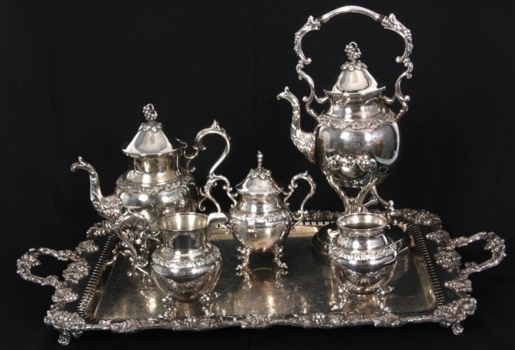 6 Pc. Silver Plated Tea Set: 6 Pc. Silver Plated Tea Set. By the Birmingham Silver Co. (Ct. U.S.A), silver on copper tea set includes tilter teapot w/ burner, tea pot, covered sugar, waste bucket, creamer and large tray measuring