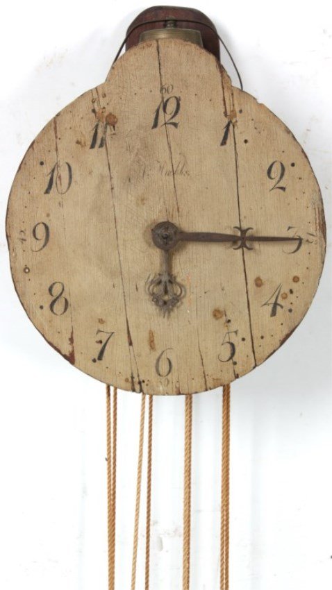 Antique Wooden Works Wall Clock: Antique Wooden Works Wall Clock. 11 in. wood dia., bell strike at the top, weight driven wooden works movement, iron weights, missing pendulum. 14 in. high