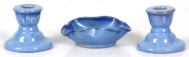 3 Pcs. Signed Fulper Pottery: 3 Pcs. Signed Fulper Pottery. Blue glazed dish with wavy & pinched rim, has Fulper decal label; 1.75 in. high x 5 in. wide x 3.5 in. deep. Pr. blue candle holders; 3 in. high.