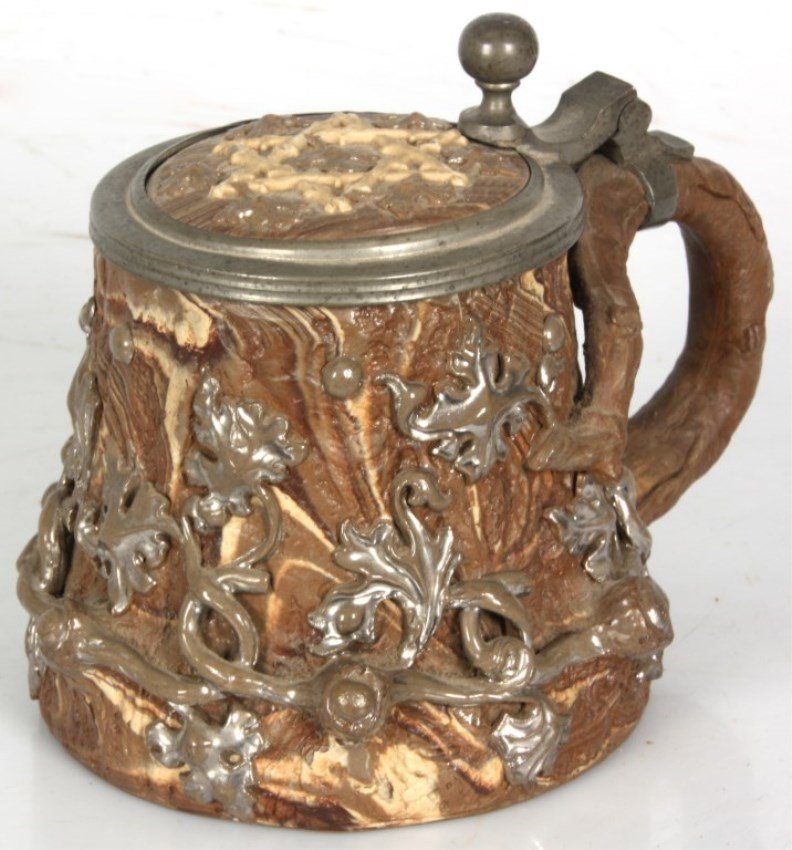 Early Mettlach Judaica Stein: Early Mettlach Judaica Stein. With oak branches and Star of David on the lid; signed with “VB” for Villeroy & Boch. In good condition with no breaks or hairlines. 5.25 in. high.