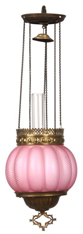 Pink Satin Swirl Library Pull Down Lamp: Pink Satin Swirl Library Pull Down Lamp. Pink satin swirl case shade has a lobed pumpkin form with brass hardware and smoke bell, glass oil font and chimney. Shade has a 5 in. fitter. 22 in. high.