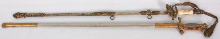 2 Swords: N.S. Meyer Inc. cadet sword, 39.5 in. long. W.A Raymond presentation lodge sword with ivory grip, etched blade presented to R.A. Redsecker, 38 in. overall length.