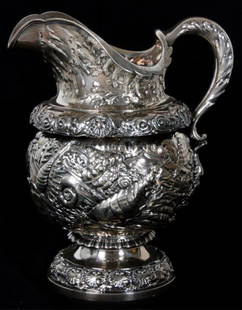 Tiffany & Co. Makers Sterling Reppouse Pitcher: Tiffany & Co. Makers Sterling Silver Repousse Mollusk Pattern Pitcher. High quality pitcher has an allover hand chased and repousse pattern with various mollusk seashells & seaweed throughout;