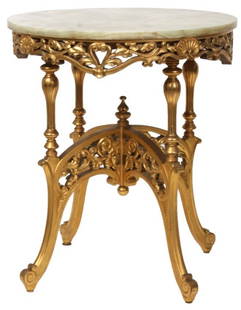 Gilt Carved Onxy Top Center Table: Gilt Carved Onxy Top Center Table. 26 in. dia. green onyx top over a pierced filigree and seashell carved apron; concave arched legs have turned supports at the top with scrolled feet, pierced