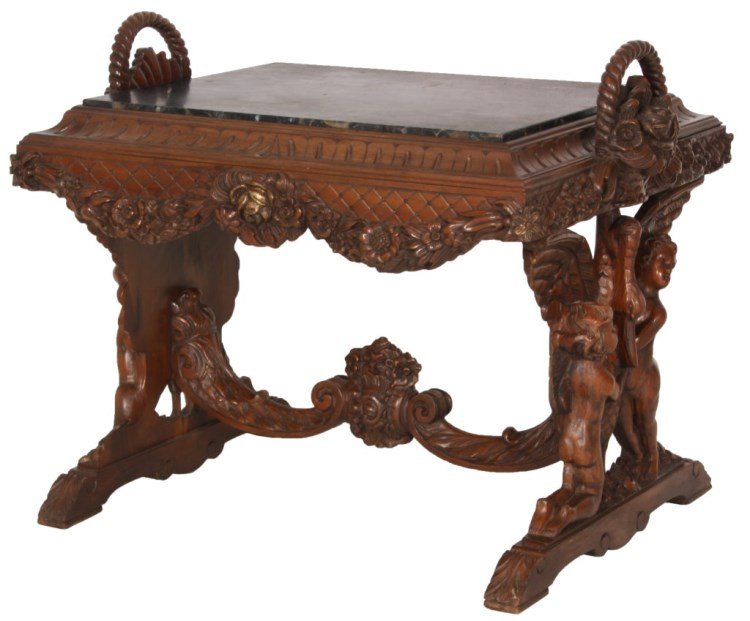Figural Marble Top Side Table: Figural Marble Top Side Table. Rectangular inset black marble top with carved border, hanging floral garland carved around the apron and floral baskets on the sides having twisted handles; has figural