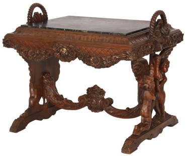 Figural Marble Top Side Table: Figural Marble Top Side Table. Rectangular inset black marble top with carved border, hanging floral garland carved around the apron and floral baskets on the sides having twisted handles; has