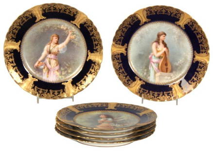 6 Limoges Hand Painted Plates: 6 Limoges Hand Painted Plates. 9 in. dia. porcelain plates have a deep cobalt border with gilt enamel highlight edge; portraits are each titled “Fleurs Eclose” and artist signed E. Furlaud.