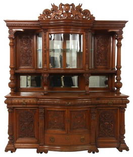 Massive Horner Oak Curio Sideboard: Massive R.J. Horner Lion Carved Oak Curio Sideboard. Large pierced carved crest with figural winged griffins, medallion center and filigree; the top has a single door beveled serpentine front glass