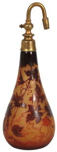 Signed D'Argental Cameo Cut Atomizer: Signed D'Argental Cameo Cut Atomizer. A long teardrop form with saffron background and deep red floral, leaf and vine pattern hanging from the top with brass atomizer collar and spout signed