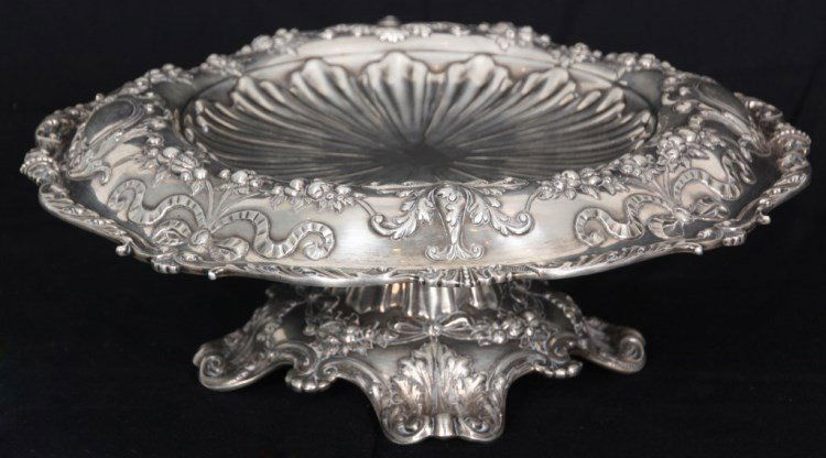 Gorham Sterling Silver Footed Compote: Gorham Sterling Silver Footed Compote. The round tray has a repousse center bowl design measuring 7 in. dia. with a wide rolled over rim having a ribbon, medallion and filigree with hanging fruit bord