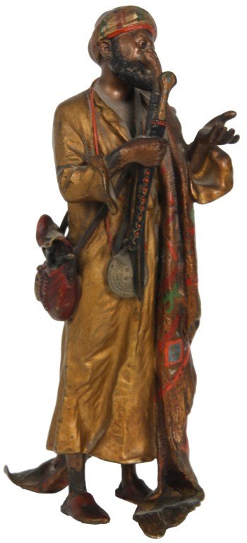 Franz Bergman Cold Painted Bronze Sword Merchant: Franz Bergman Cold Painted Bronze Sword Merchant. Austrian figural cold painted bronze sculpture of an Arab merchant holding 2 swords in one hand, his other hand stretched out to accept payment, he we