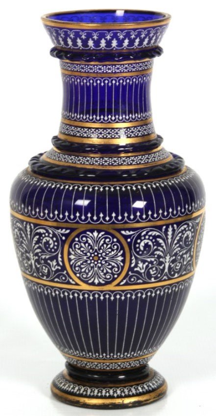 Lobmeyr Enamel Cobalt Glass Vase: Lobmeyr Enamel Cobalt Glass Vase. A deep blue baluster form vase with long bottle neck, flaring rim and wavy borders; has fancy white enamel design with gilt highlights. Signed mark on the bottom. In