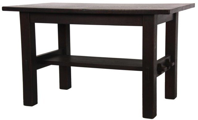 Gustav Stickley Oak Breakfast Table: Gustav Stickley Oak Breakfast Table. Overhanging top with apron and heavy legs; side stretcher tenons exposed through the legs and double keyed through tenons on the center stretcher. Table has a good