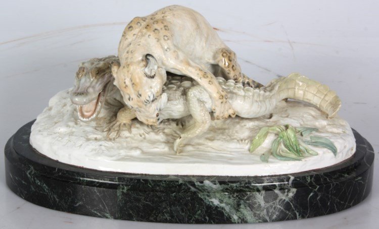 P.J. Mene Porcelain Jaguar & Caiman Grouping: Pierre Jules Mene (1810-1879, France) porcelain figural grouping with a jaguar battling on top of a large caiman (South American type of alligator) along a river bank. Grouping is on an oval marble ba