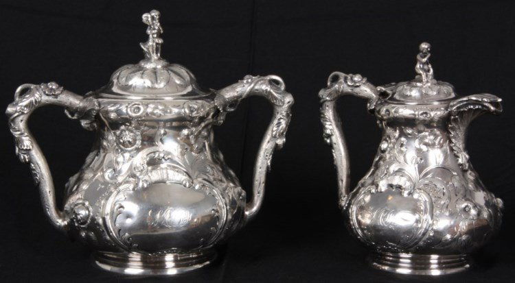 2 Pc. Boston Coin Silver Tea Set c.1850: 2 Pc. Boston Coin Silver Tea Set c.1850. Teapot (6.25 in. high) and covered 2 handled urn (7.25 in. high), both have a beautiful and intricate hand chased floral and filigree design with tree branch h