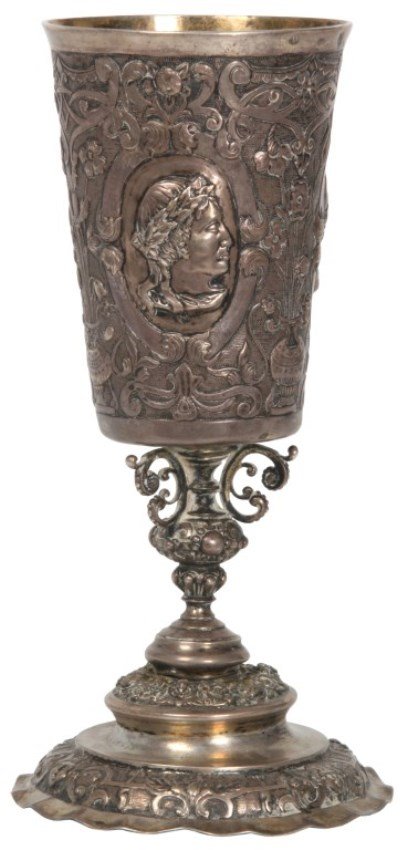 Early Continental Silver Repousse Chalice: Early Continental Silver Repousse Chalice. Conical bowl with oval portrait panels, urn with filigree background design and a gold washed interior, has a fancy stem and a round stepped foot with a wavy