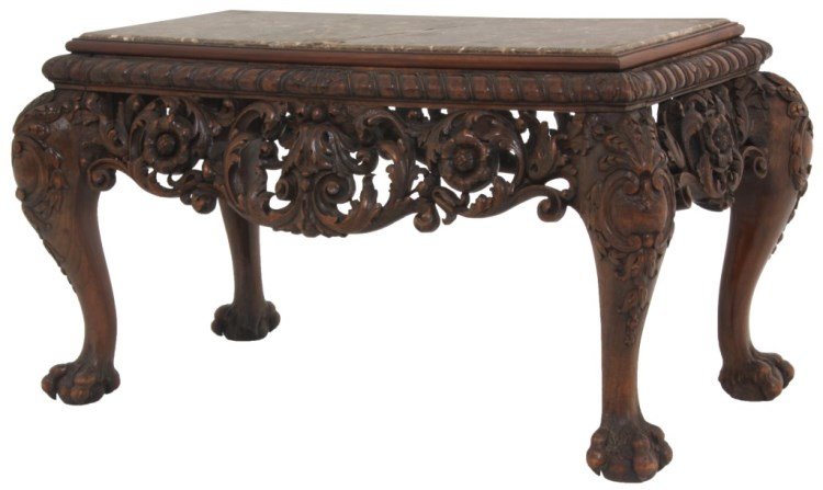 Carved Walnut Marble Top Coffee Table: Carved Walnut Marble Top Coffee Table. Inset brown marble top with a gadroon and leaf carved edge, large pierced carved apron with swirling filigree and rosettes, stands on cabriole legs carved with m