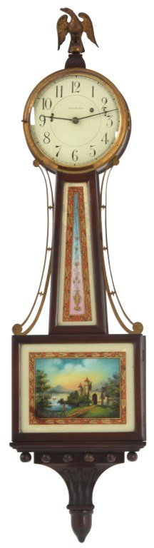 Waltham Mahogany Presentation Banjo Clock: Waltham Mahogany Presentation Banjo Clock. Original 7 in. painted metal dial signed “Waltham”, with black hour numbers, original hands; typical brass 8 day weight driven movement is numbered “91