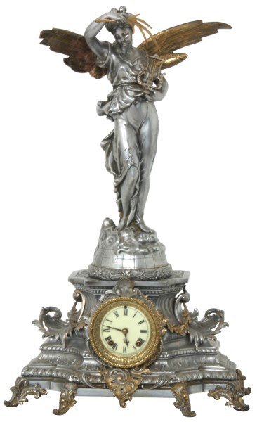 Ansonia Figural "Gloria" Mantle Clock: Ansonia Figural Mantle Clock. Large winged figure titled “Gloria”, a figure standing on a globe with wreath on the lower border, she holds a leafy branch and a lyre; on a filigree decorated base t