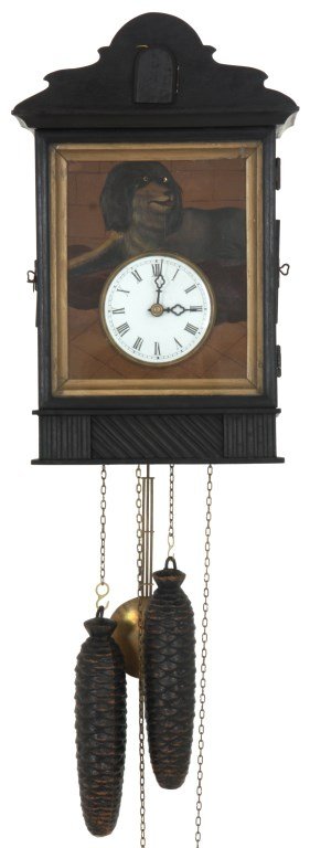 20th C. Swinging Eye Cuckoo Clock: 20th C. Swinging Eye Cuckoo Clock. An ebonized wood case with shadow box door compartment in front of the portrait of a dog painted on tin, dog has open apertures in the eyes which are animated swingi