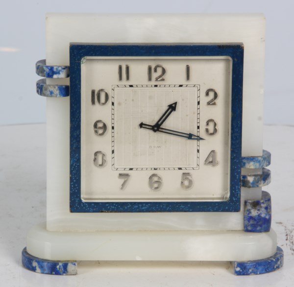 2 Tone Deco Onyx Desk Clock: 2 Tone Deco Onyx Desk Clock. White onyx case with blue onyx mounts, blue painted metal bezel with beveled crystal, 3.25 in. x 3.25 in. silvered dial with applied hour numbers and blue hands; 8 day spr