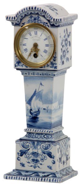 Delft Blue & White China Clock: Delft Blue & White China Clock. Blue and white porcelain case having a miniature grandfather clock form with a harbor ship scene and filigree decoration, signed on the bottom “Delft”. 2.75 in. por