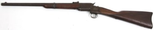Triplett & Scott 1865 "Kentucky" Repeating Carbine: Triplett & Scott 1865 "Kentucky" Repeating Carbine. Round 22 in. barrel, rifled bore, .50 caliber rimfire, walnut stock, 7 round magazine tube contained in the butt stock; a thumb operated button to t