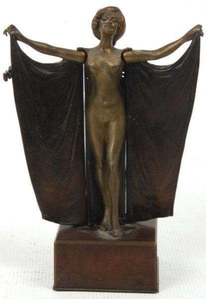 Carl Kauba Mechanical Erotic Nude Bronze: Carl Kauba Mechanical Erotic Nude Bronze. Standing figure of a woman on a block plinth, she wears garments wrapped over her shoulders with her hands stretched out in front holding the top corners of t