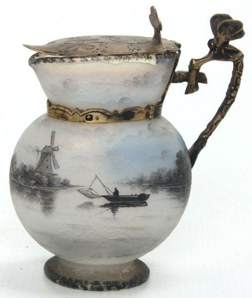 Daum Nancy Syrup Pitcher: Daum Nancy Syrup Pitcher. Wonderful glass pitcher has an opaque body which is enamel decorated with a lake scene of trees, brush and a windmill on the shoreline with a small fishing boat, signed “Da
