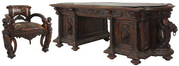 Monumental Walnut Marble Top Desk & Chair: Monumental Walnut Marble Top Desk & Chair. Black marble top inset in a gadroon and leaf carved walnut top border, has 3 drawers with filigree carved fronts along the top and carved corbels, open