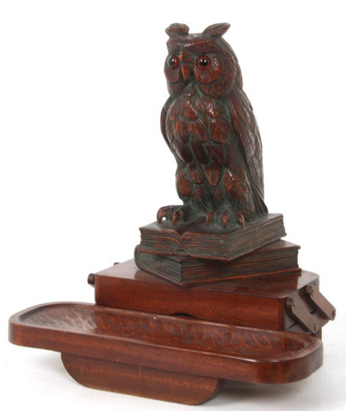 Figural Carved Mahogany Owl Ink Stand: Figural Carved Mahogany Owl Ink Stand. Has a swing arm hinged lid which swings back exposing the 2 pc. glass jar inkwell; seated on the lid is a figural carved owl with glass eyes and perched on a sta
