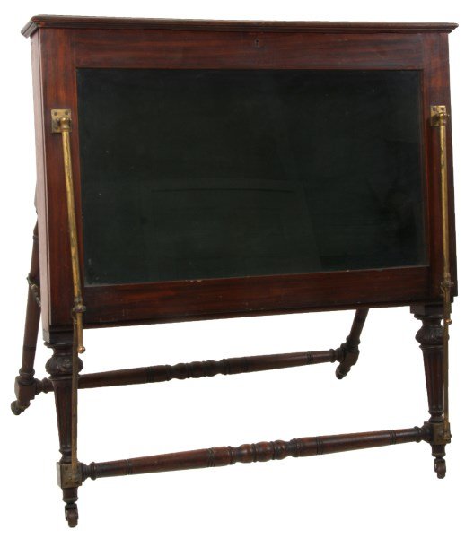 Mahogany Drop Front Portfolio Cabinet: Mahogany Drop Front Portfolio Cabinet. Has an overhanging lift top, drop front with glass panel, brass hinged tubular hardware with support legs, felt back interior and stands on turned and carved leg